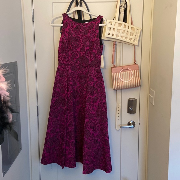 Size 4 Badgley Mischka collection never been worn. in shade magenta black